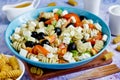 Greek salad with fresh vegetables, feta cheese, pasta and black olives Royalty Free Stock Photo