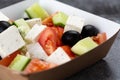 Greek salad of fresh vegetables with tomato, cucumber, olives and cheese. salad dressed with olive oil Royalty Free Stock Photo