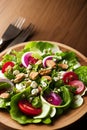 Greek salad for healthy food in wood background