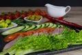 Greek salad or horiatiki with large pieces of tomatoes, cucumbers, onion, feta cheese and olives in white bowl closeup Royalty Free Stock Photo