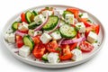 Greek salad in light plate isolated, villages salad, horiatiki salat made with tomatoes, diced feta Royalty Free Stock Photo