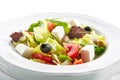 Macro Shot of Greek Salad in Light Plate Isolated on White Background Royalty Free Stock Photo