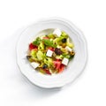 Top View of Greek Salad in Light Plate Isolated on White Background Royalty Free Stock Photo