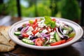 greek salad with olives, feta cheese, and fresh veggies