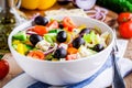 Greek salad of organic tomatoes, cucumber, red onion, olives and feta cheese Royalty Free Stock Photo