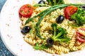 Greek Salad with pasta. Mediterranean cuisine. Food recipe background. Close up