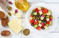 Greek salad on plate, ingredients on paper Royalty Free Stock Photo