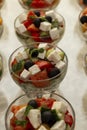 Greek salad in serving bowls. Business meetings, buffet in hotels and restaurants. Close-up. Vertical Royalty Free Stock Photo