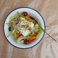 Greek salad with sliced tomatoes, onions, green peppers, olives and Feta cheese Royalty Free Stock Photo