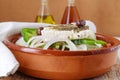 Greek salad with tomato, onion, cucumber, sweet paprika, feta cheese , oregano, vinigar, olive oil and olives. Royalty Free Stock Photo