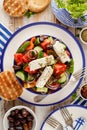 Greek salad. Traditional Greek salad consisting of fresh vegetables such as tomatoes, cucumbers, peppers, onions, oregano and oliv Royalty Free Stock Photo