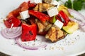Greek salad, vegetables with cheese. Grilled vegetables eggplant, paprika, onions. Serving on a wooden Board on a rustic Royalty Free Stock Photo
