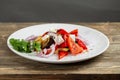 Greek salad, vegetables with cheese. Grilled vegetables eggplant, paprika, onions. Serving on a wooden Board on a rustic Royalty Free Stock Photo