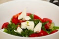 Greek salad with vegetables and FCTA cheese in a deep bowl with olive oil. Royalty Free Stock Photo