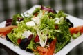 Greek salad on a white plate Royalty Free Stock Photo