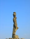 Greek sculpture in park on sky background