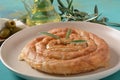 Greek spanakopita or spiral pie made of phyllo dough, spinach.