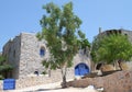 Greek Stone House with Blue Door, Gate and Window Shutters in Chios Island Royalty Free Stock Photo