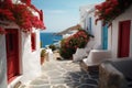 Greek street, whitewashed houses, beautiful red liana flowers, path to the sea