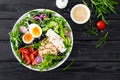 Greek style healthy lunch bowl with oatmeal, boiled egg and fresh vegetable salad with feta cheese Royalty Free Stock Photo