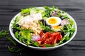 Greek style healthy lunch bowl with oatmeal, boiled egg and fresh vegetable salad with feta cheese Royalty Free Stock Photo