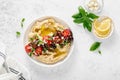 Greek style vegan mediterranean hummus with fresh vegetables, olives, olive oil and feta cheese. Top view Royalty Free Stock Photo