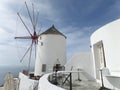 Greek Style White Windmill and Architectures in the afternoon Sunlight, Santorini Island of Greece Royalty Free Stock Photo