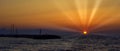 Greek sunset with visible sun rays - Gouves, Crete, Greece