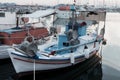 Greek traditional small blue boat in the port Royalty Free Stock Photo