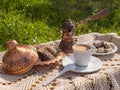 Greek Turkish brewed coffee and marble halva on a table with a handmade tablecloth and a copper coffee maker and candy maker on Royalty Free Stock Photo