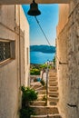 Greek village typical view with whitewashed houses and stairs. Plaka town, Milos island, Greece