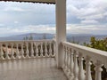 Greek white balcony with balusters on Aegean sea Royalty Free Stock Photo