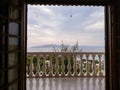 Greek white balcony with balusters on Aegean sea Royalty Free Stock Photo