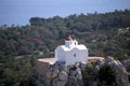 Greek white chapel on a hill