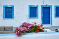 Greek white house with blue door and window blinds Oia village on Santorini island in Greece Royalty Free Stock Photo