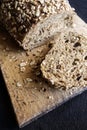 Greek Whole-wheat brown bread on Bread Board Royalty Free Stock Photo