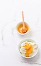 Greek yoghurt with honey on marble table Royalty Free Stock Photo