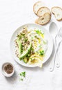 Greek yogurt, avocado, quinoa, breakfast bowl on white background, top view. Healthy diet food Royalty Free Stock Photo