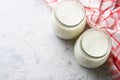 Greek yogurt in glass jars.
