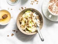 Greek yogurt with granola, banana, apple, honey on a light background, top view. Delicious breakfast