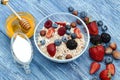 Greek yogurt granola and berry mix. Top view. Delicious healthy muesli with raspberry, blueberry, strawberry, hazelnut Royalty Free Stock Photo