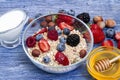Greek yogurt granola and berry mix. Top view. Delicious healthy muesli with raspberry, blueberry, strawberry, hazelnut Royalty Free Stock Photo