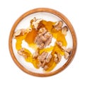 Greek yogurt with honey and roasted walnuts, in a wooden bowl Royalty Free Stock Photo