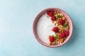 Greek yogurt with raspberries and granola. Top view flat lay. Healthy breakfast