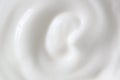 Greek yogurt, sour cream texture. White creamy dairy food background