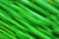 Green abstract background. Fresh diagonally flowing color.