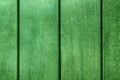 Green Abstract Background texture of wooden decking with parallel planks with gaps