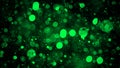 Green abstract bokeh background. real dust particles with real lens flare stars. glitter lights . Abstract lights defocused. Merry