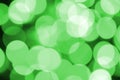 Green abstract Christmas blurred luminous background. Defocused artistic bokeh lights image Royalty Free Stock Photo