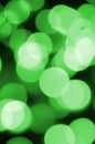 Green abstract Christmas blurred luminous background. Defocused artistic bokeh lights image Royalty Free Stock Photo